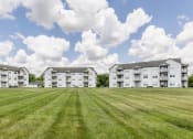 Thumbnail 28 of 29 - Apartments In Indianapolis, IN For Rent - Riverchase - Beautifully Landscaped Courtyard In Front Of Apartment Buildings