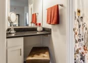 Thumbnail 15 of 29 - a vanity with a stool and a shower in a 555 waverly unit