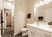 Thumbnail 16 of 29 - a bathroom with a toilet sink and mirror