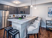 Thumbnail 8 of 55 - Arbors at Turnberry pet friendly apartments and townhomes Pickerington, Ohio large kitchen, wood style flooring, stainless steel appliances, cabinet space
