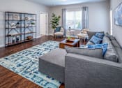 Thumbnail 10 of 55 - Arbors at Turnberry pet friendly apartments and townhomes Pickerington, Ohio spacious living room with wood style flooring and natural light
