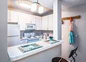 Thumbnail 13 of 55 - Arbors at Turnberry pet friendly apartments and townhomes Pickerington, Ohio large kitchen, wood style flooring, ample cabinet space, breakfast bar seating