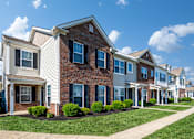 Thumbnail 33 of 55 - Arbors at Turnberry pet friendly apartments and townhomes Pickerington, Ohio lush landscape, updated exterior, attached garages
