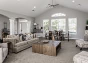 Thumbnail 15 of 19 - a living room filled with furniture and a large window