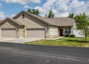 Thumbnail 16 of 19 - a house with two garage doors