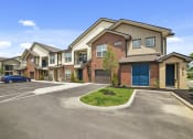 Thumbnail 24 of 25 - Select units offer attached garages, in addition to the beautiful landscaping, well-lit exteriors, and ample parking.