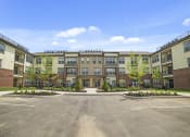 Thumbnail 22 of 25 - Beautiful and well-lit landscaping surrounds the exterior with plenty of parking available.