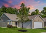 Thumbnail 8 of 16 - a home with a tree in the front yard