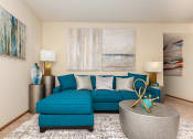 Thumbnail 8 of 27 - Dog-Friendly Apartments in Hilliard, OH - Residences at Breckenridge - Living Room with Sectional, Coffee Table, and End Tables with Lamps.