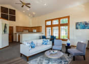 Thumbnail 7 of 27 - a living room filled with furniture and a large window
