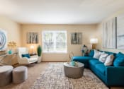 Thumbnail 1 of 27 - Pet-Friendly Apartments in Hilliard, OH - Residences at Breckenridge - Large Living Room with High Ceilings, Carpet Flooring, and a Window