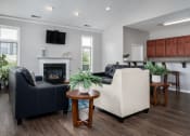 Thumbnail 15 of 21 - Comfortable living room at Catalina Club with two couches, a coffee table, and a fireplace focal point.