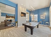 Thumbnail 12 of 25 - The game room in the renovated clubhouse includes a pool table for resident recreation.
