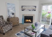 Thumbnail 3 of 19 - Pet-friendly apartment at The Boulevard in Florence, KY featuring a spacious living room with carpet flooring, high ceilings, and a sliding glass door to a private patio
