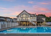 Thumbnail 4 of 29 - Speedway In Apartments - Gated Pool With Sundeck And Lounge Chairs.