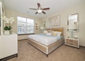 Thumbnail 3 of 25 - A pet-friendly, updated modern bedroom at Austin Park Apartments in Miamisburg, Ohio offers oversized closets, carpeted flooring, and natural light.