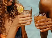 Thumbnail 49 of 55 - A man and a woman holding glasses of a beverage.