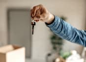 Thumbnail 53 of 55 - A person is holding a key in their hand.