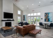 Thumbnail 15 of 25 - Modern living room with fireplace, flat-screen TV, and stylish furnishingsModern living room with fireplace, flat-screen TV, and stylish furnishings