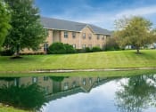 Thumbnail 25 of 25 - One-bedroom apartment building with landscaped grounds and pond views at The Coleman in Canal Winchester, OH