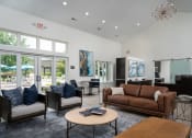 Thumbnail 5 of 25 - Bright living room with stylish furniture, coffee table, and access to a private patio through sliding glass doors