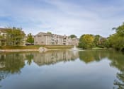 Thumbnail 16 of 19 - Peaceful lake with a fountain in front of a residential building at The Boulevard in Florence, KY