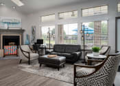 Thumbnail 13 of 23 - a living room filled with furniture and a large window