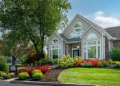 Thumbnail 22 of 23 - a house with a garden in front of it