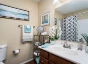 Thumbnail 9 of 23 - a bathroom with a toilet sink and mirror