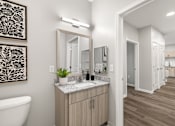 Thumbnail 48 of 105 - A bathroom with a tub, sink, and mirror.
