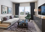 Thumbnail 3 of 14 - A modern living room with a grey sofa, a green armchair, a coffee table, and a flat-screen TV mounted on the wall.