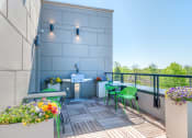 Thumbnail 23 of 31 - our apartments showcase a naturally well lit balcony with a grill