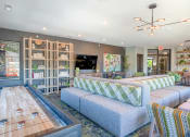 Thumbnail 18 of 31 - a living room filled with furniture and a large wooden table