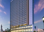 Thumbnail 47 of 61 - a tall building with many windows on the side of it