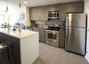 Thumbnail 11 of 17 - Stainless steel appliances in kitchen