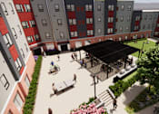 Thumbnail 9 of 14 - A courtyard with a black pavilion surrounded by red and grey buildings.