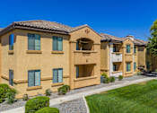 Thumbnail 7 of 24 - A row of houses with a clear blue sky above them.
