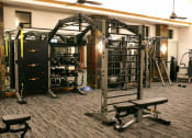 Thumbnail 30 of 51 - a gym with weights and equipment on the floor