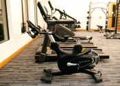 Thumbnail 28 of 51 - a row of exercise bikes in a gym