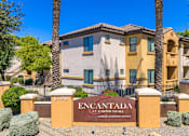 Thumbnail 1 of 24 - A sign that says Encantada in front of a building.