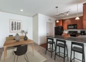 Thumbnail 9 of 51 - a kitchen and dining area in a 555 waverly unit