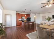 Thumbnail 20 of 51 - a kitchen and dining area in a 555 waverly unit
