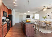 Thumbnail 21 of 51 - a kitchen and dining area in a 555 waverly unit