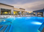 Thumbnail 1 of 39 - a large swimming pool with lounge chairs and umbrellas