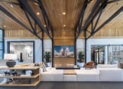Thumbnail 42 of 51 - a living room with a large white couch and wooden ceilings