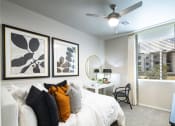 Thumbnail 18 of 51 - a bedroom with a large bed and a ceiling fan