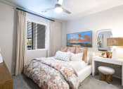 Thumbnail 23 of 51 - a bedroom with a bed and a window