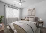 Thumbnail 30 of 51 - a bedroom with a large bed and a ceiling fan