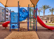 Thumbnail 8 of 23 - a playground with a slide and climbing equipment in a park