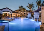 Thumbnail 1 of 23 - a swimming pool with blue lights at night at the resort
